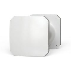 A white, square-shaped single room heat recovery unit with visible control buttons and an attached power cord.